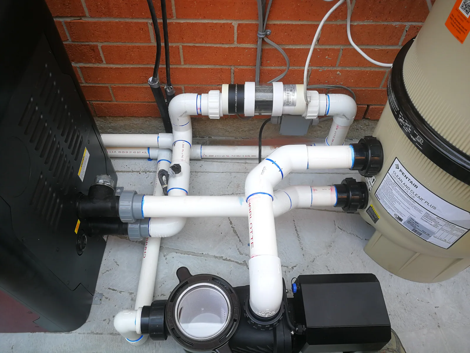 Pool equipment pad plumbing and filtration
