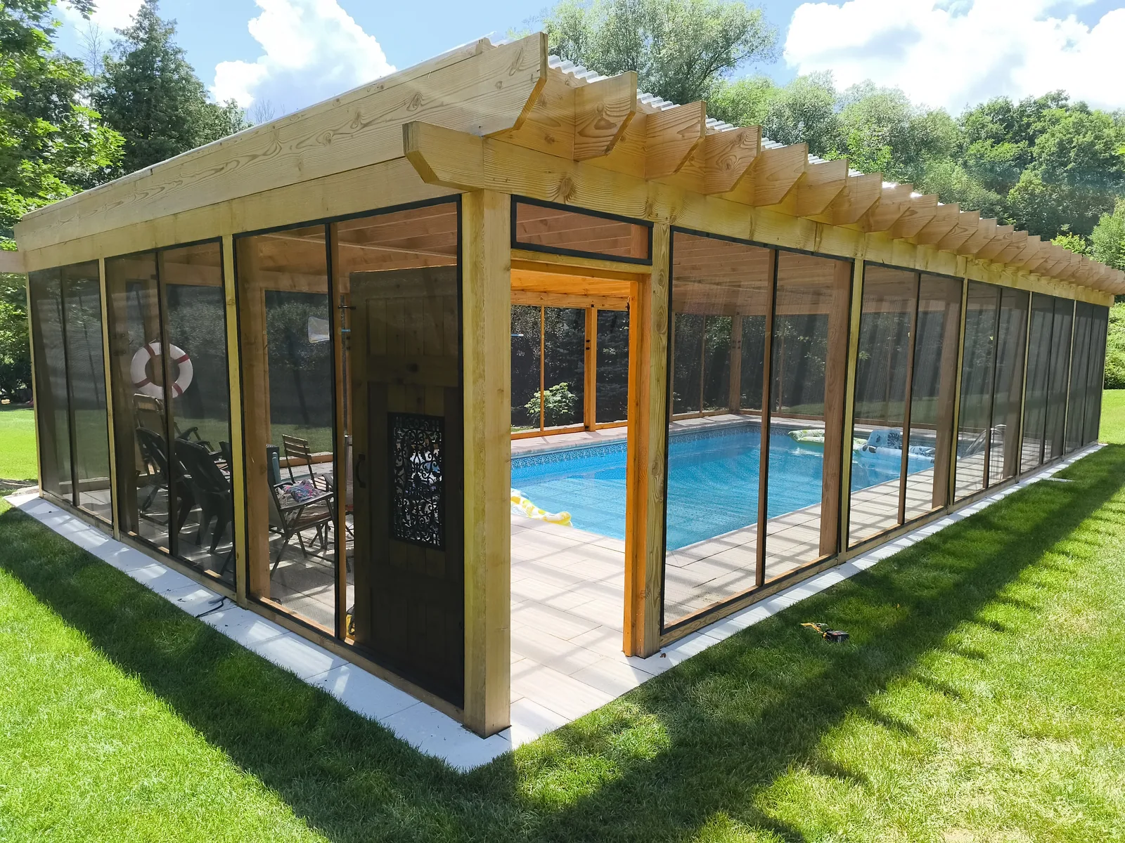 Glass and timber enclosure built over an inground pool
